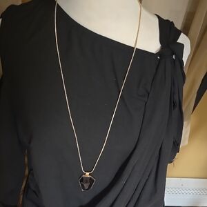 Elegant Gold Necklace with Black Pendant